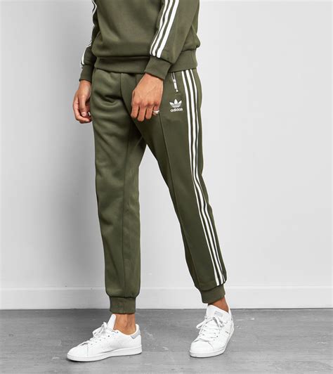 green adidas track pants men